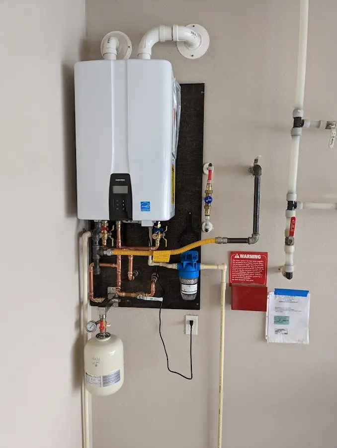 Professional plumber installing copper piping in a Wrightsboro home